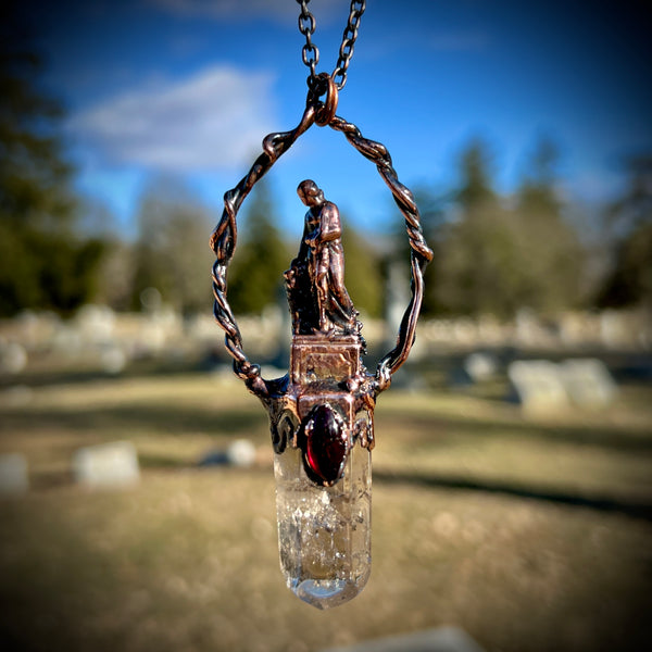 Woman Holding an Anchor with Smoky Quartz and Garnet Copper Necklace