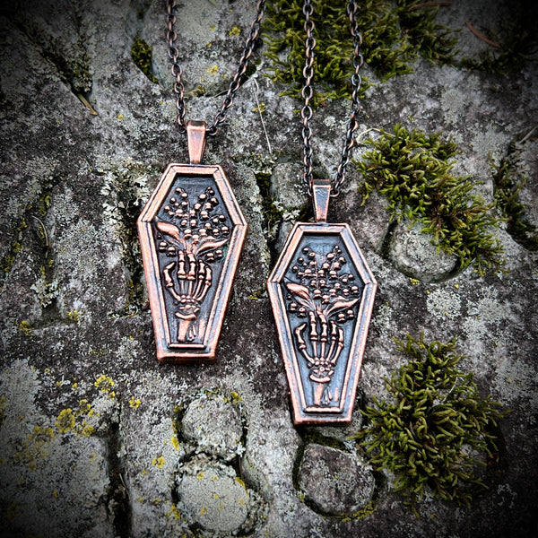 Skeleton Hand Holding Lily of the Valley Copper Necklace