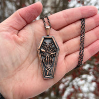 Skeleton Hand Holding Lily of the Valley Copper Necklace