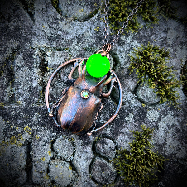 Five Horned Beetle Holding a Uranium Glass Marble Copper Necklace