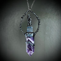 Woman with a Cross and Banded Amethyst Necklace with Gunmetal Patina