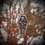 Skeleton Hand Holding Lily of the Valley Copper Necklace