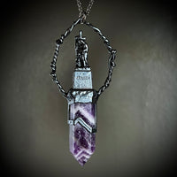 Woman with a Cross and Banded Amethyst Necklace with Gunmetal Patina