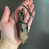 Cloaked Woman with Garden Quartz, and Peach Moonstone Necklace with Gunmetal Patina