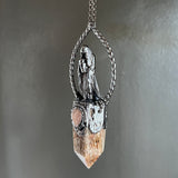 Cloaked Woman with Garden Quartz, and Peach Moonstone Necklace with Gunmetal Patina