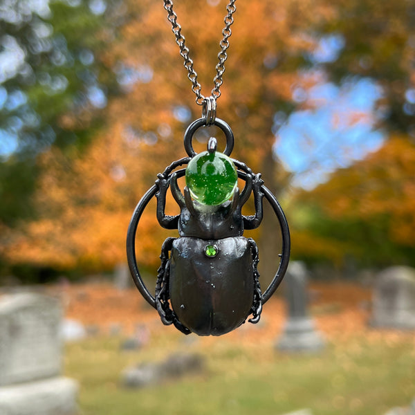 Five Horned Beetle Holding a Uranium Glass Marble Copper Necklace