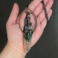 Woman Holding an Anchor with Prasiolite and Malachite Copper Necklace