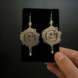 Uranium Glass and Silver Earrings with Skull Design