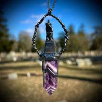 Woman with a Cross and Banded Amethyst Necklace with Gunmetal Patina