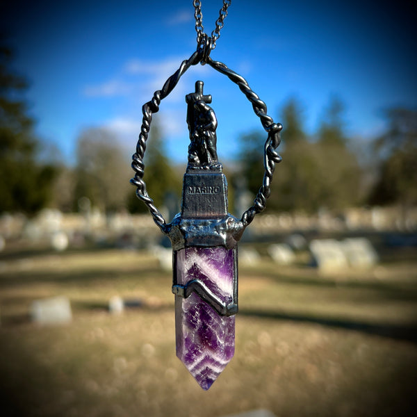 Woman with a Cross and Banded Amethyst Necklace with Gunmetal Patina