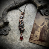 Pierced Hand Holding a Rose Copper Necklace