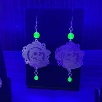 Uranium Glass and Silver Earrings with Skull Design