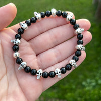 Shiny Black Onyx Bracelet with Skull Beads