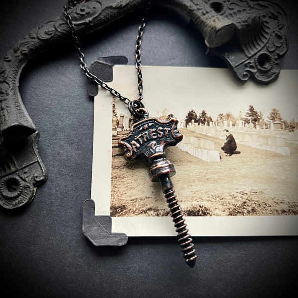 At Rest Coffin Screw Copper Necklace